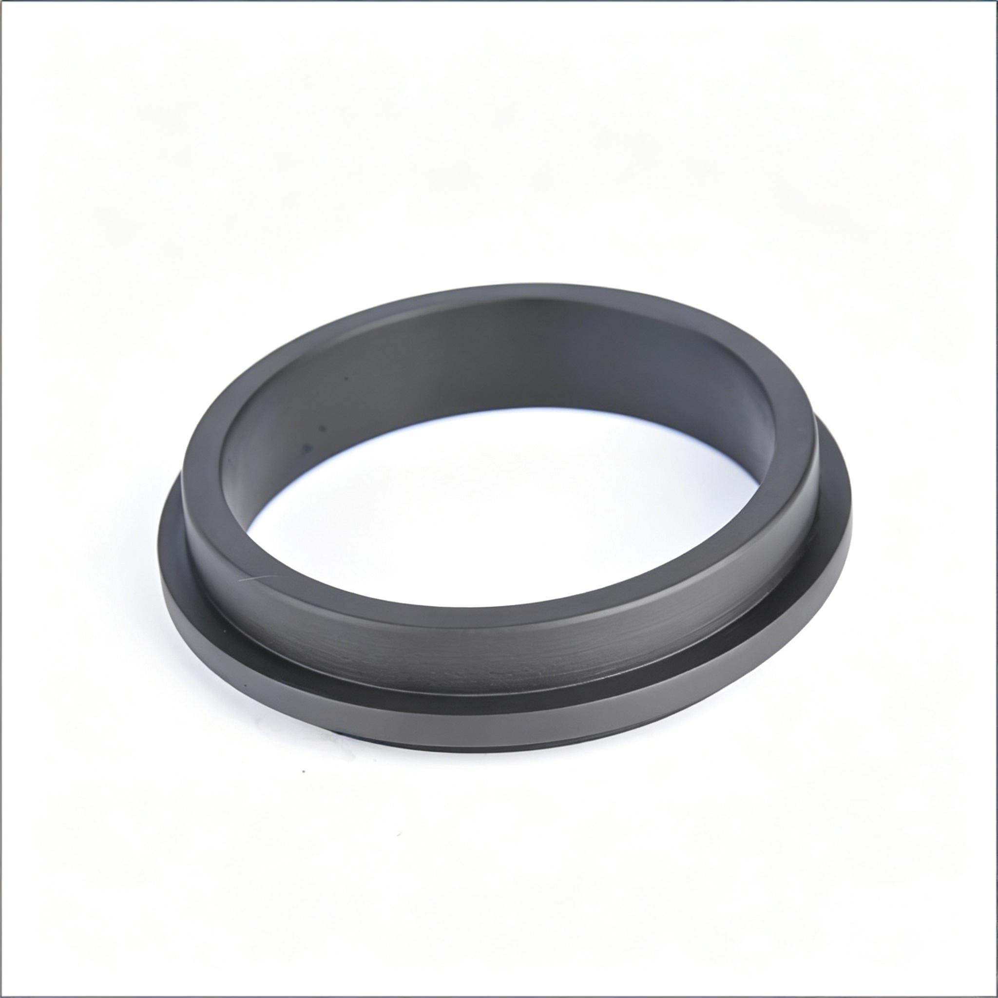 High-density carbon graphite bearing bushing or thick-walled sealing ring with smooth surface finish.