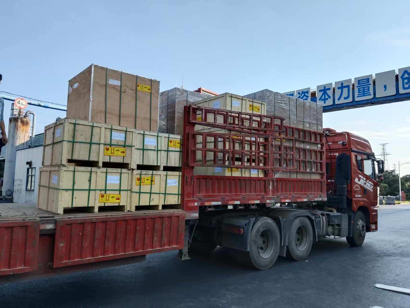 Secure packaging of graphite furnace parts in reinforced plywood cases on a delivery truck.