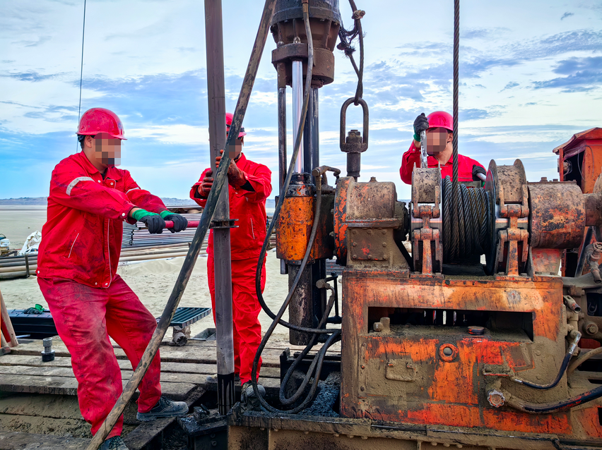 A scene of diamond core drilling operations at a geological exploration site, featuring drill bits manufactured using high-purity graphite molds for efficient and stable core sampling