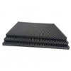 Three stacked grooved graphite plates showing consistent groove quality across batch production