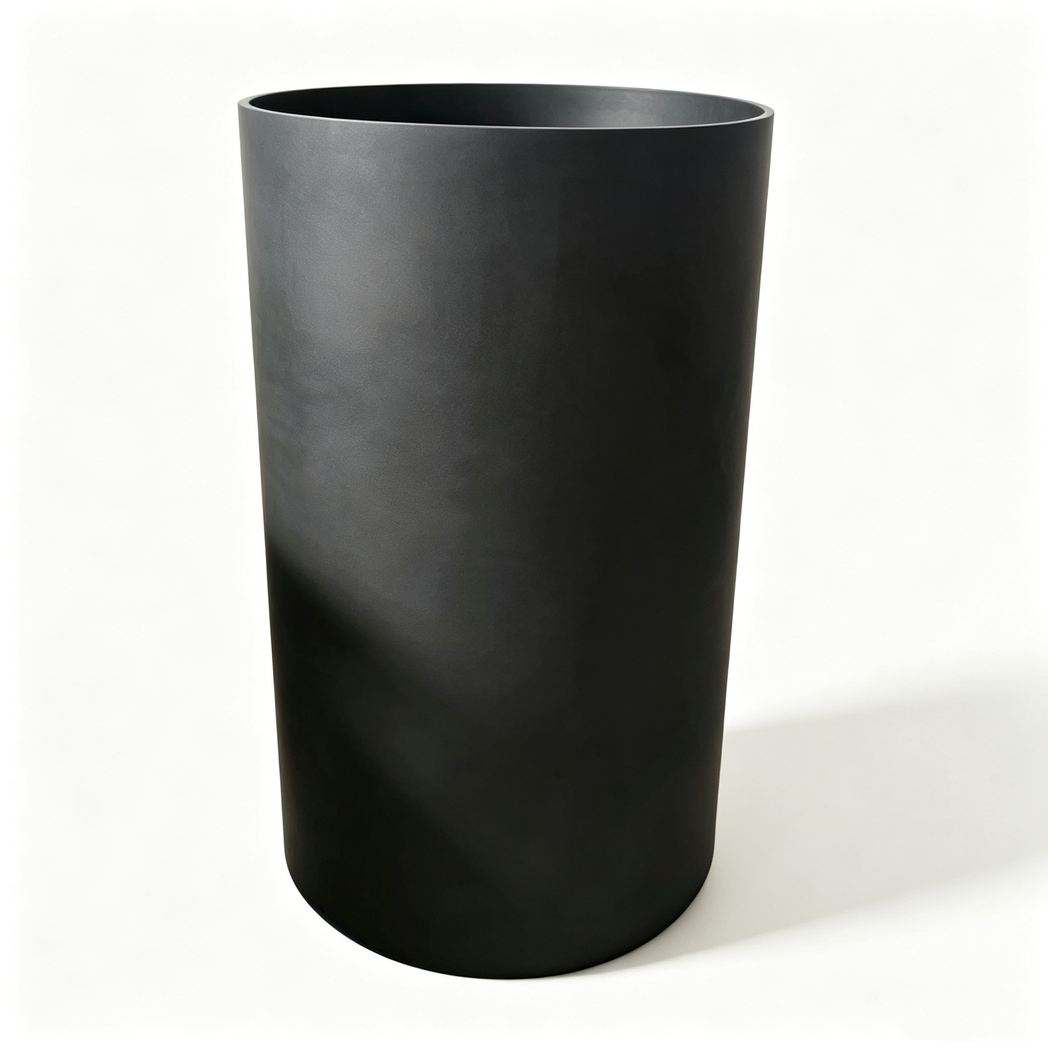 High wall graphite crucible dark finish side view, tall cylindrical industrial melting container with rounded bottom, dense graphite material for high temperature furnace use NHD Carbon