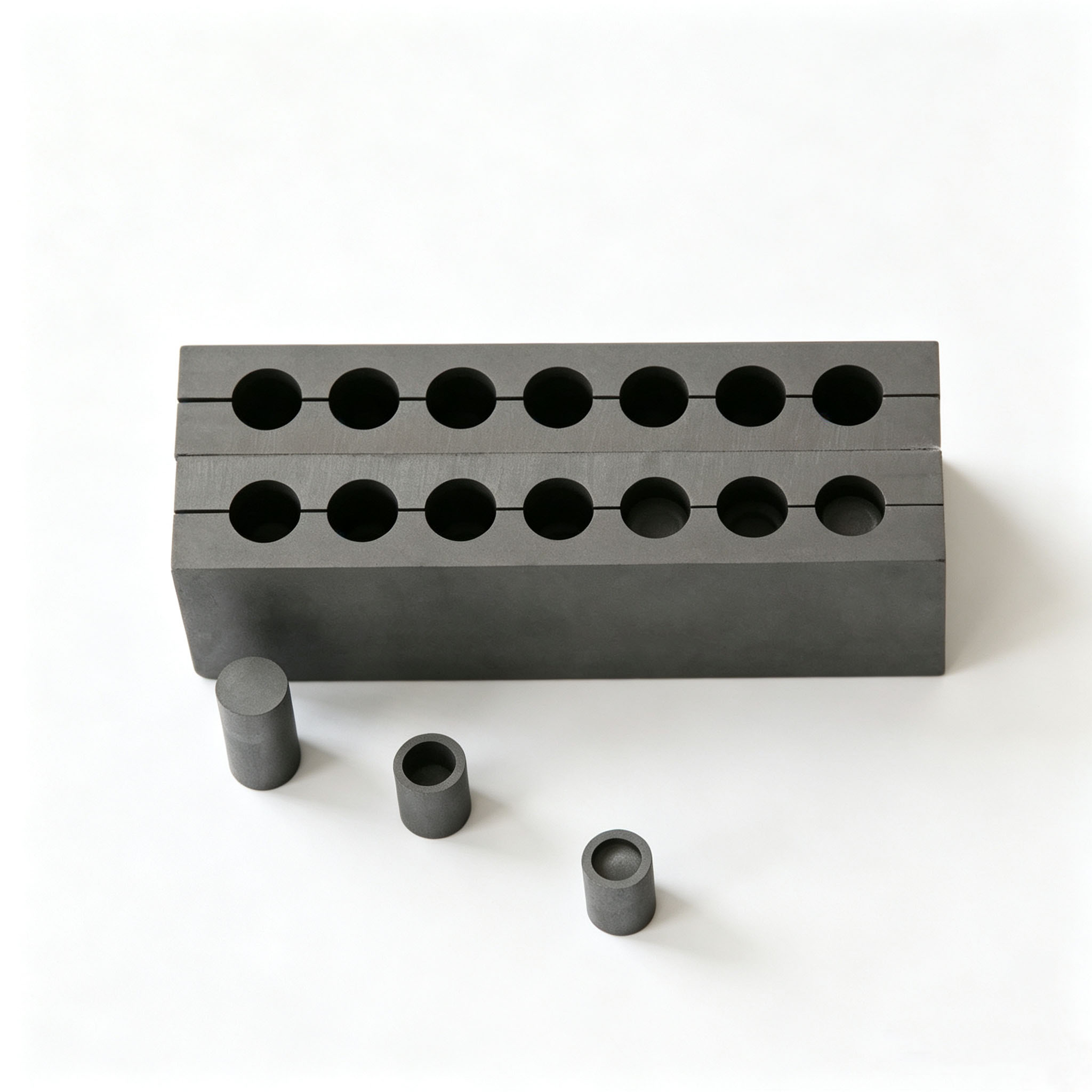 Split multi-hole isostatic graphite mold set with graphite punch, used for hot press sintering diamond stone cutting segments, high density fine grain graphite die