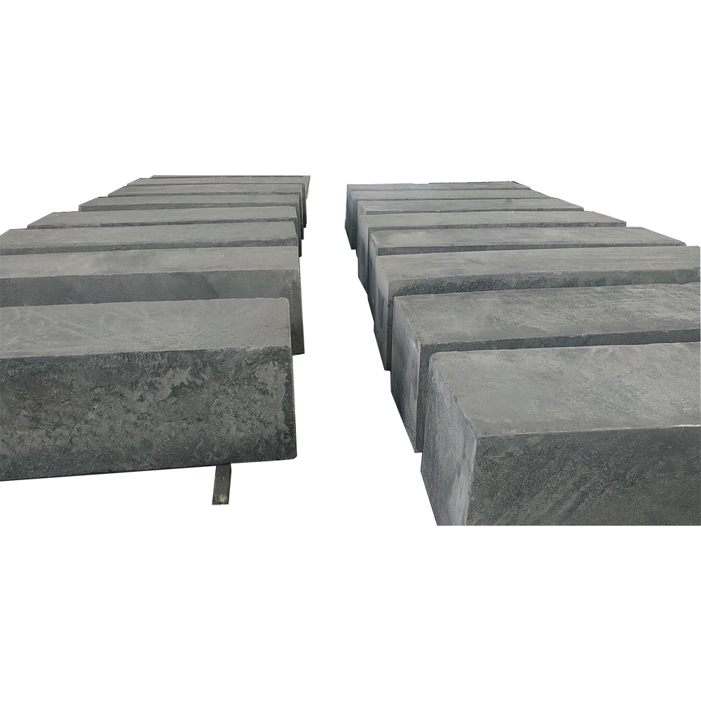 Batch of medium grain graphite blocks arranged in production line, vibration molded with consistent 0.8mm-2.0mm grain size and stable density for industrial mold making