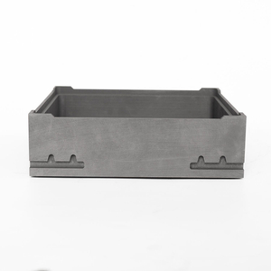 Front view of isostatic graphite sagger highlighting bottom positioning features and smooth outer surfaces machined to tight tolerances for vacuum sintering