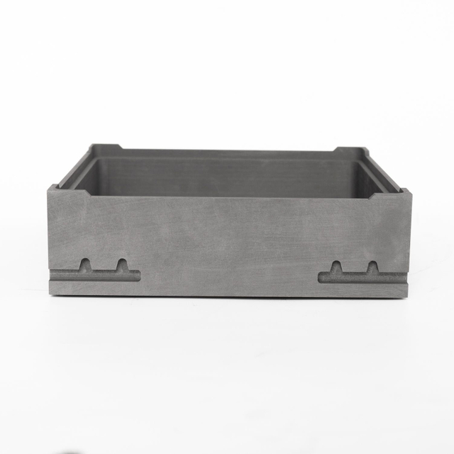 Front view of isostatic graphite sagger highlighting bottom positioning features and smooth outer surfaces machined to tight tolerances for vacuum sintering
