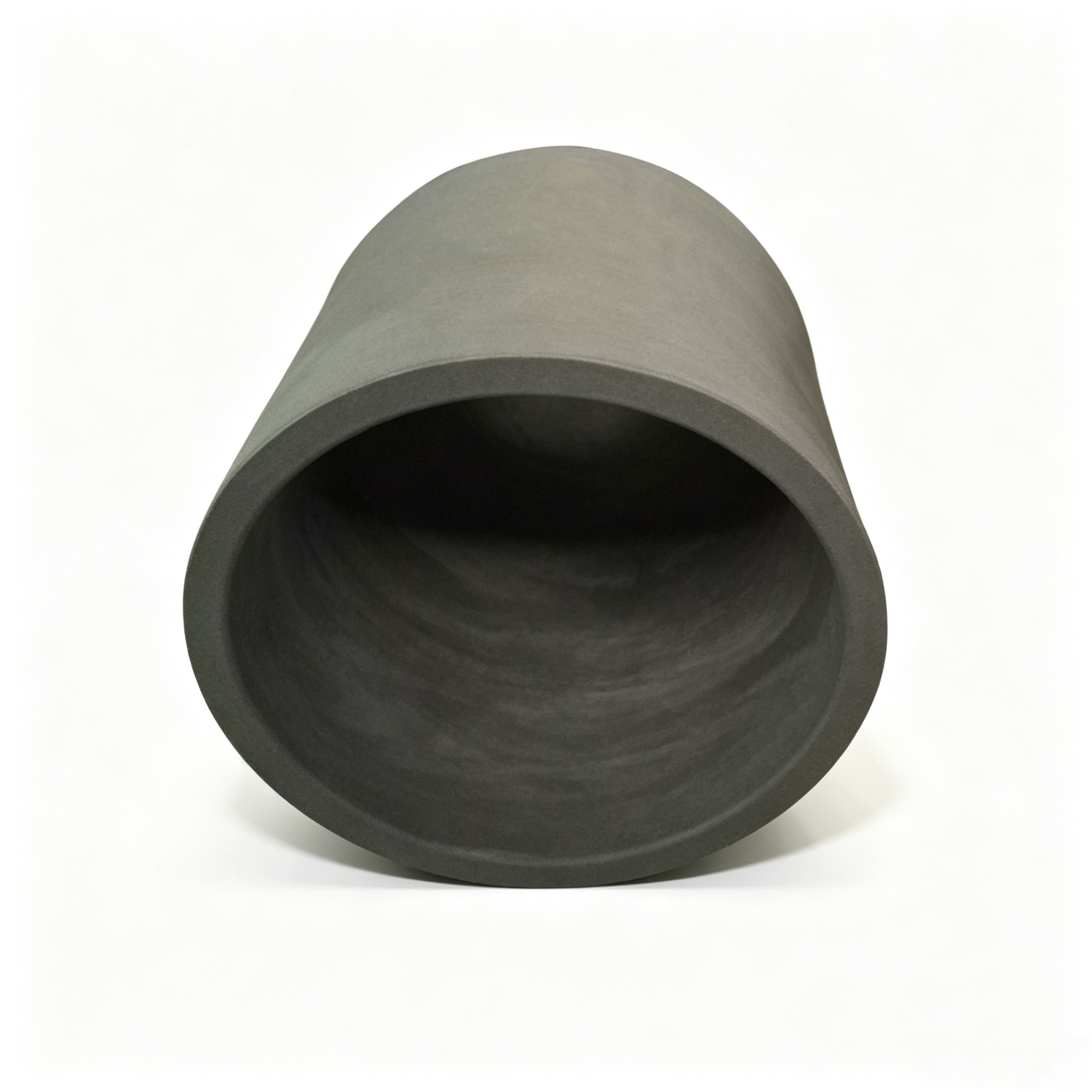 Standard graphite crucible thick wall top view angled, smooth dark interior surface, cylindrical industrial melting pot for precious metal refining, high density isostatic graphite NHD Carbon