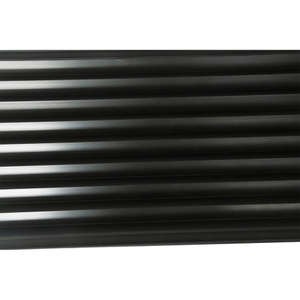 Close-up of glossy grooved graphite plate surface showing precise parallel CNC machined slots with smooth finish - NHD Carbon