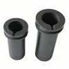 Two double ring graphite crucibles standing side by side, polished graphite surface, professional product display