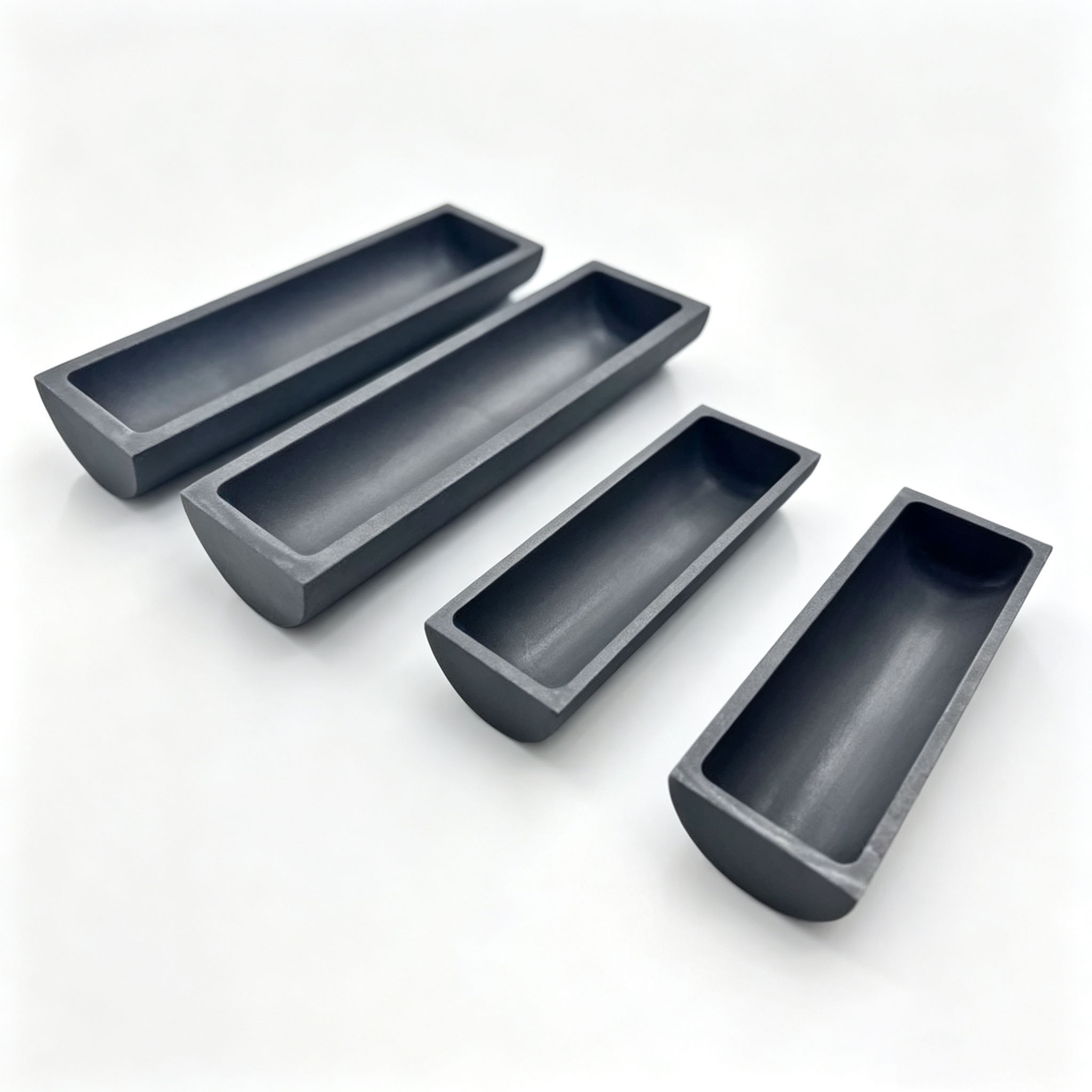 Four small graphite boats with different lengths, polished graphite sintering tray