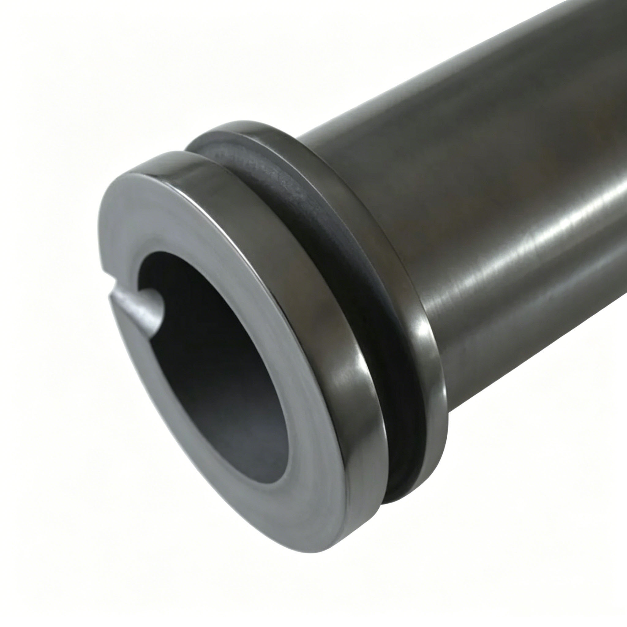 Close-up view of double ring graphite crucible top showing retention ring groove and precision machined pouring spout for safe metal transfer