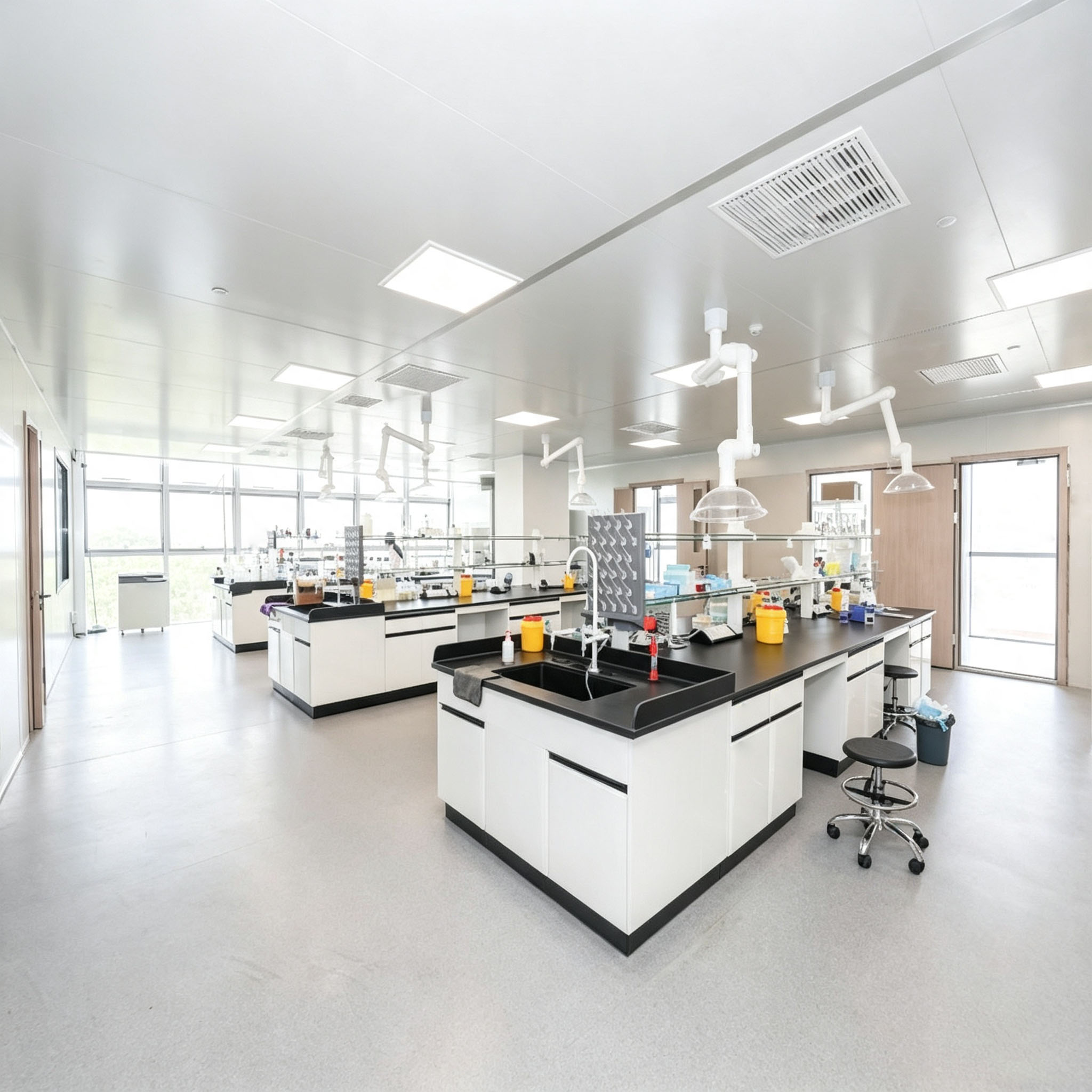 Spacious modern clean testing laboratory with chemical workbenches, fume extraction hoods, metal material composition analysis lab for precious metal purity testing, alloy research, factory quality control and university material experiment